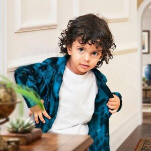 Eric Shijo John, three-year-old Wayanad child model on a fashion runway